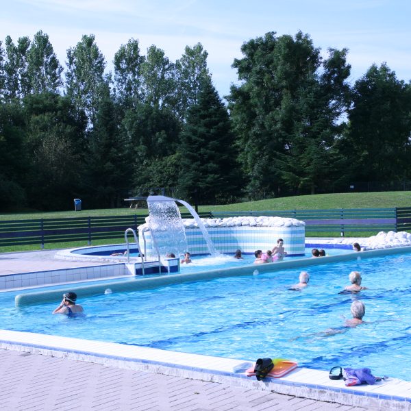 Swimmers in the outdoor pool of the Nautical Center